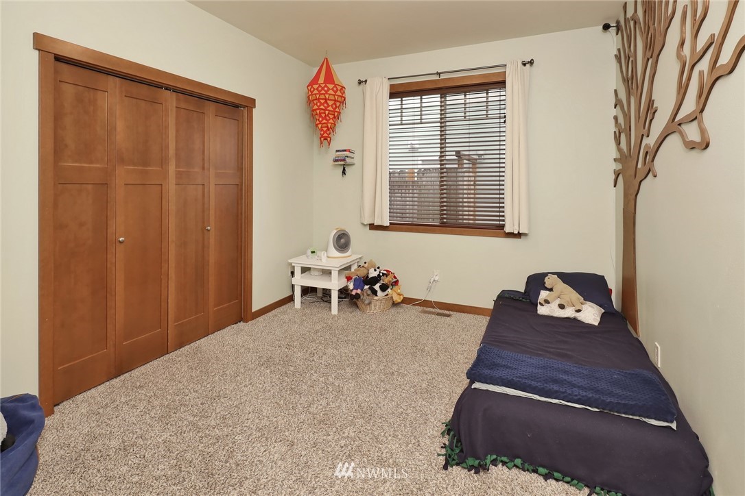 804 Red Maple Loop Everson, WA 98247 - Photo 18 of 40 a hallway with a couch and a window