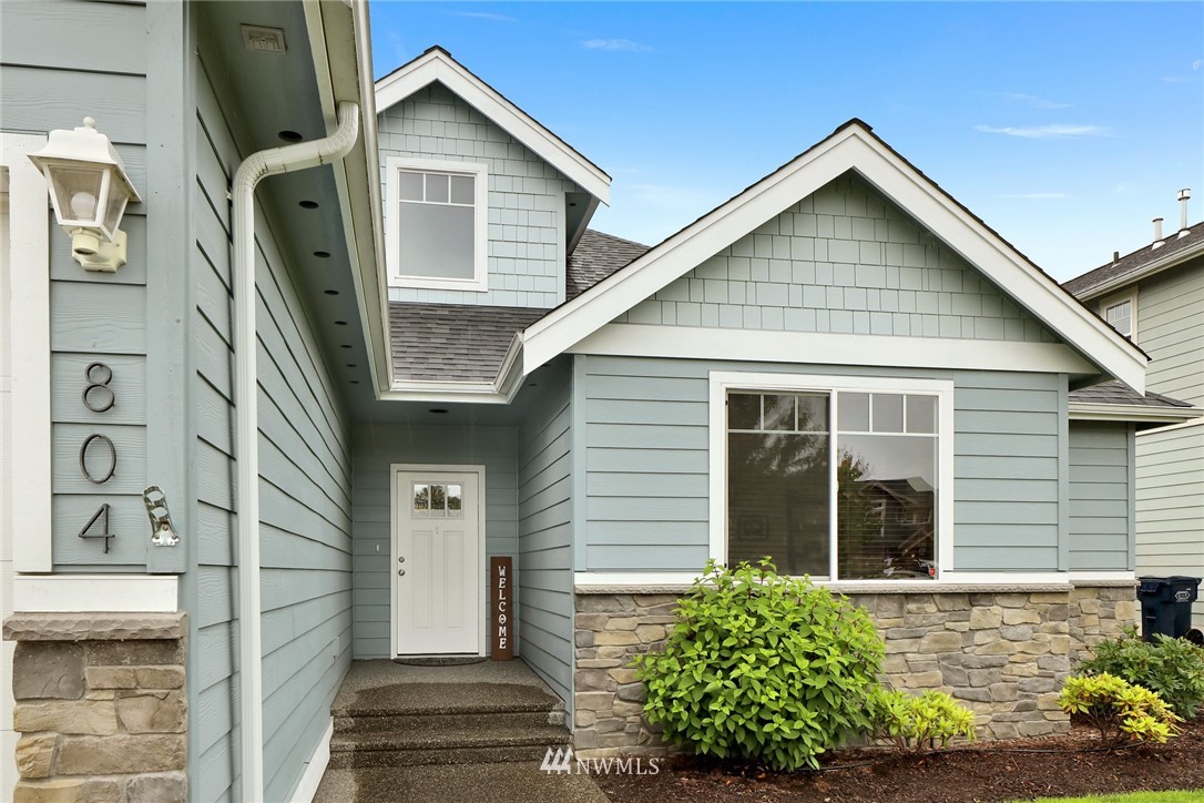 804 Red Maple Loop Everson, WA 98247 - Photo 3 of 40 a front view of a house with a garden
