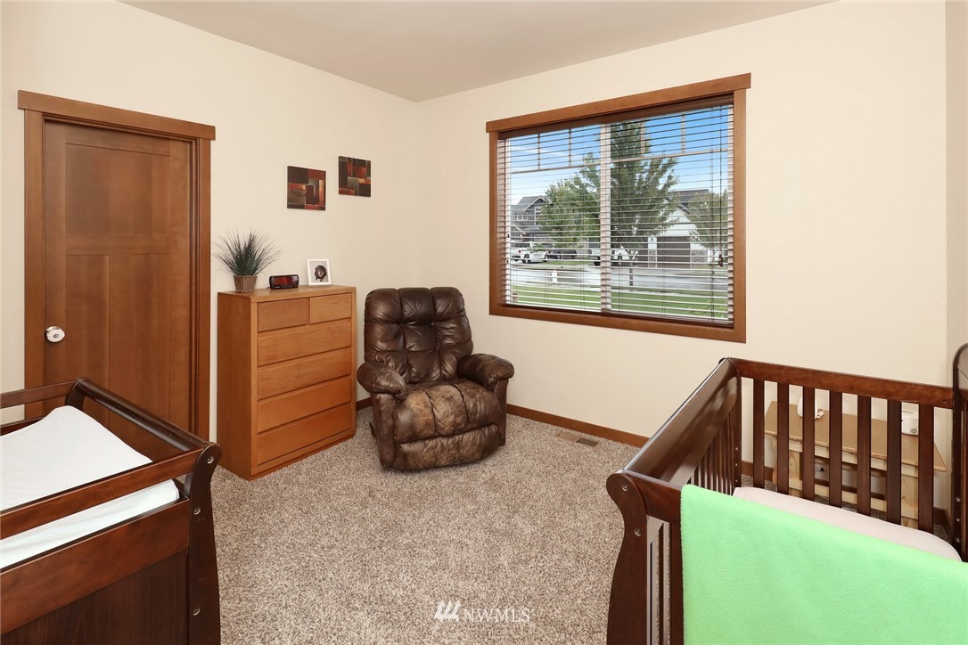 804 Red Maple Loop Everson, WA 98247 - Photo 21 of 40 a bedroom with furniture and a window