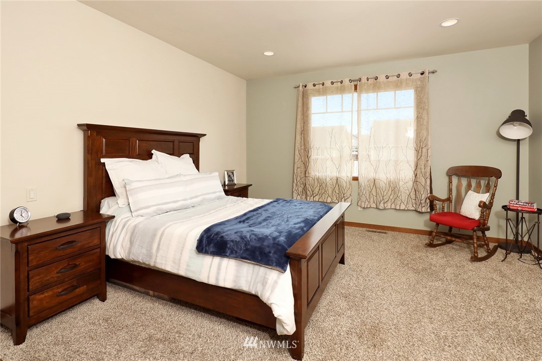 804 Red Maple Loop Everson, WA 98247 - Photo 22 of 40 a bedroom with a bed chair and a window