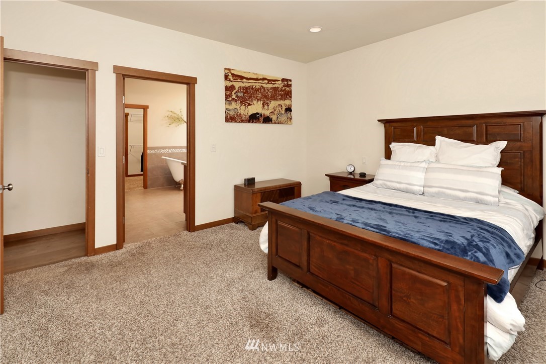 804 Red Maple Loop Everson, WA 98247 - Photo 23 of 40 a bedroom with a bed and a painting on the wall