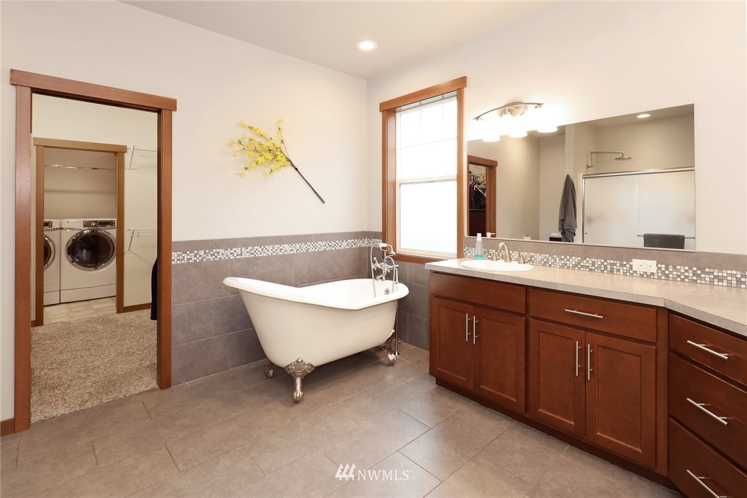 804 Red Maple Loop Everson, WA 98247 - Photo 26 of 40 a bathroom with a granite countertop sink and a mirror