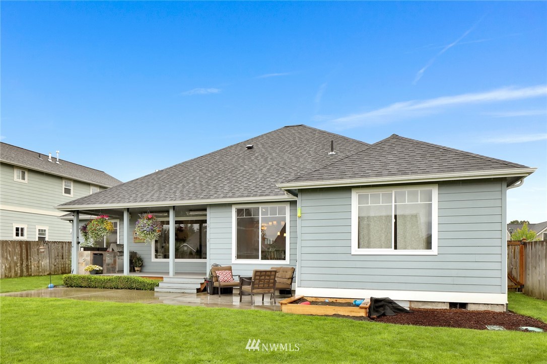 804 Red Maple Loop Everson, WA 98247 - Photo 32 of 40 a backyard of a house with table and chairs