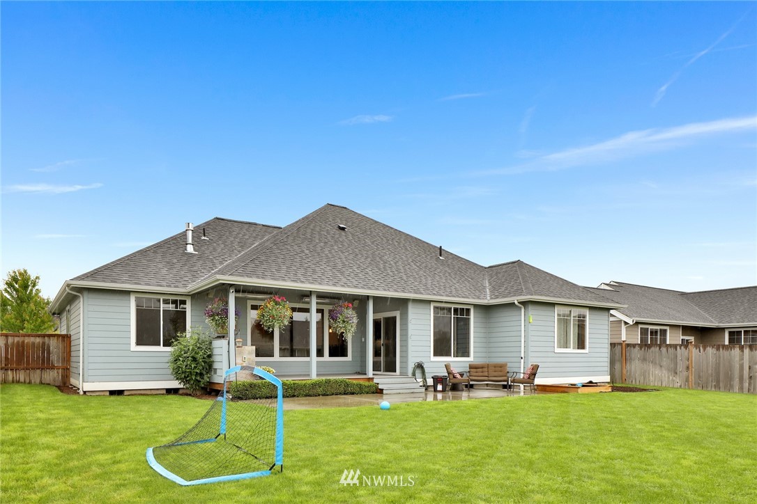 804 Red Maple Loop Everson, WA 98247 - Photo 34 of 40 a front view of a house with a yard and garage