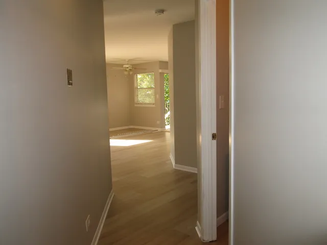 a view of a kitchen cabinets and wooden floor