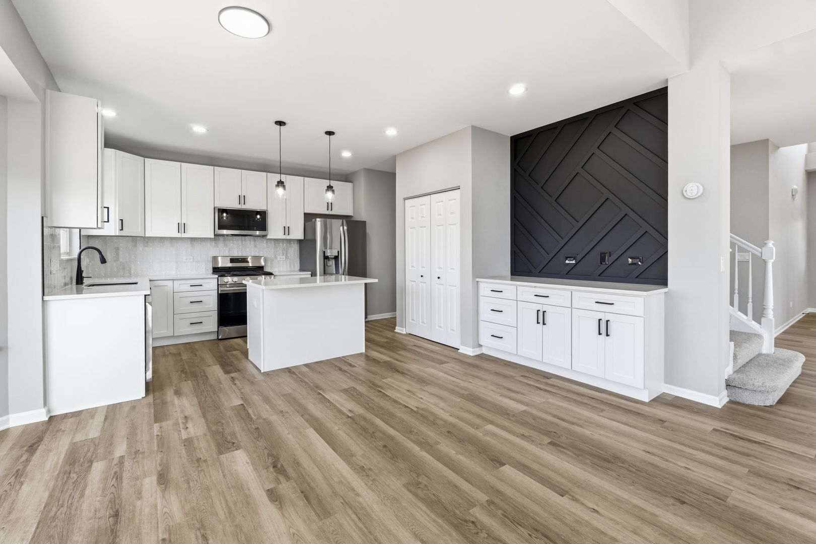 22718 Bass Lake Road Plainfield, IL 60544 - Photo 5 of 15 a kitchen with stainless steel appliances a refrigerator sink and microwave