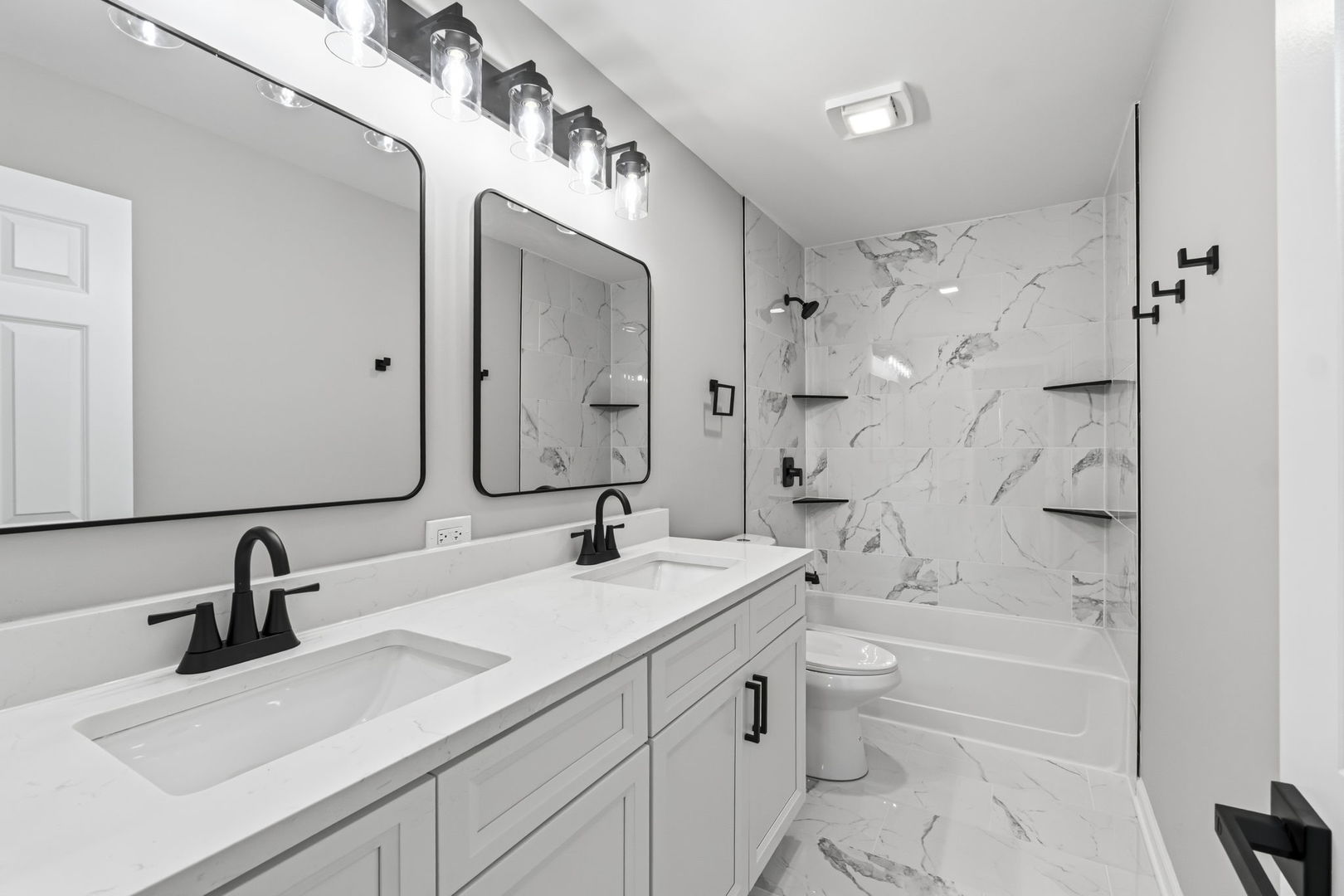 22718 Bass Lake Road Plainfield, IL 60544 - Photo 6 of 15 a bathroom with a double vanity sink mirror double and bathtub