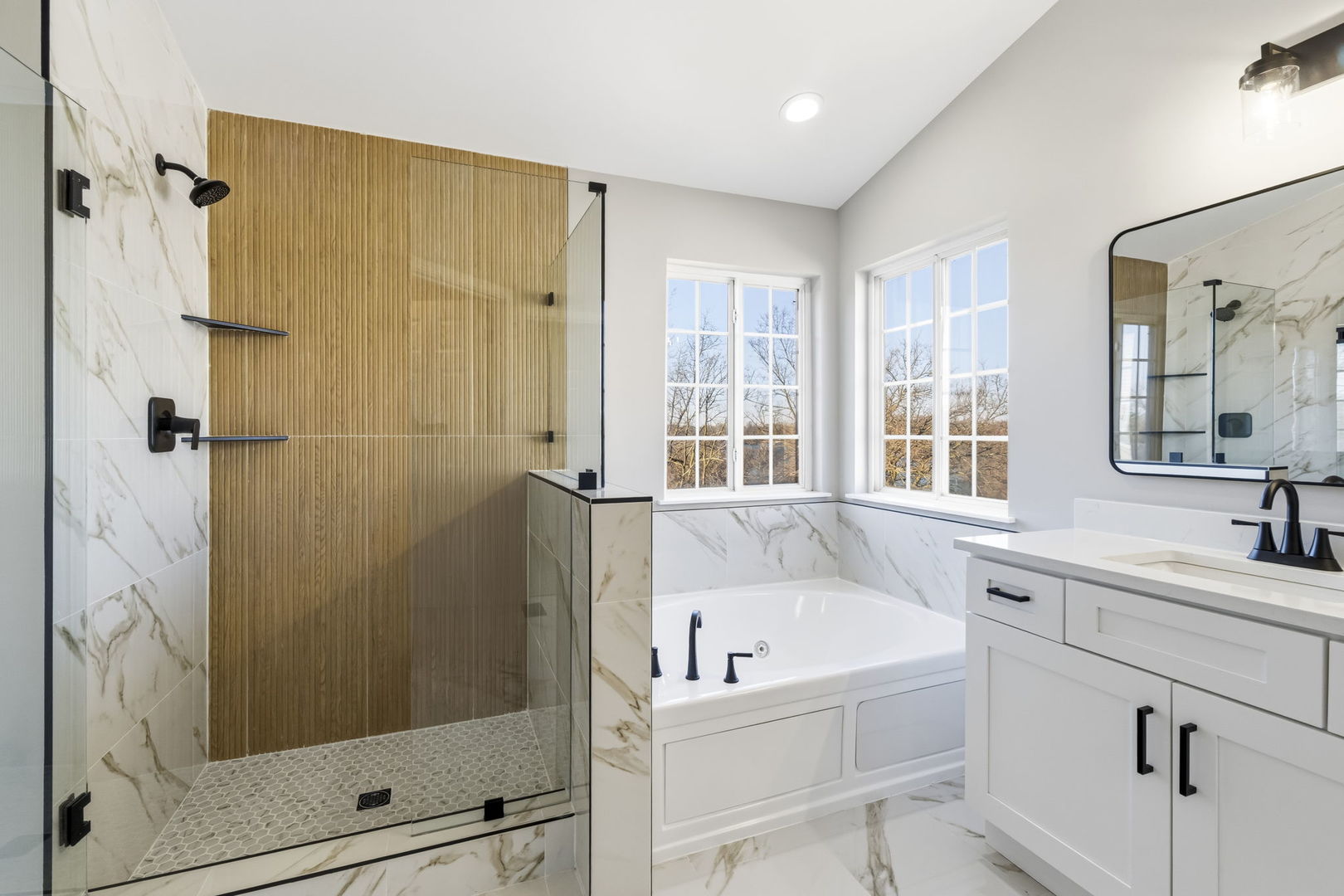 22718 Bass Lake Road Plainfield, IL 60544 - Photo 10 of 15 a bathroom with a tub sink and shower