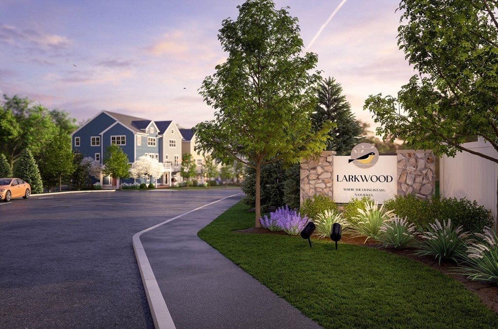 1 Maplewood Lane, Unit 333 Raynham, MA 02767 - Photo 11 of 18 a front view of a house with garden