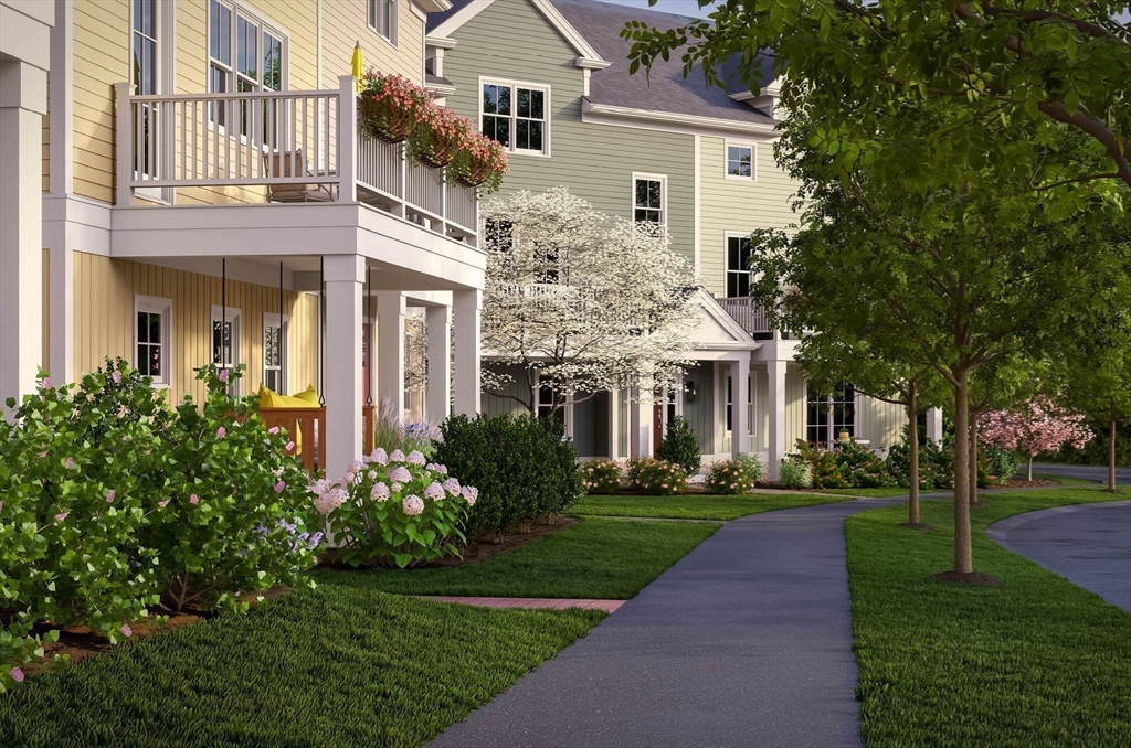 1 Maplewood Lane, Unit 333 Raynham, MA 02767 - Photo 13 of 18 a front view of a house with a yard