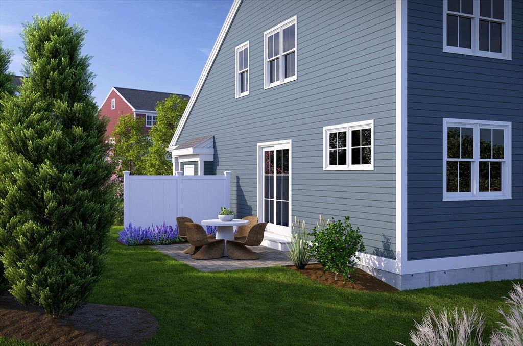 1 Maplewood Lane, Unit 333 Raynham, MA 02767 - Photo 4 of 18 a view of a house with a backyard and sitting area
