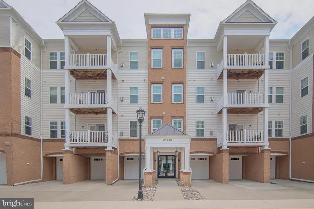 a front view of a building with many windows