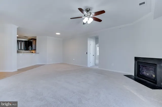 a view of a big room with windows and cabinet