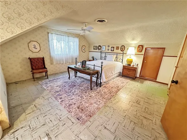 a bedroom with a bed and furniture