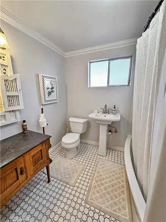 a bathroom with a sink toilet and a tub