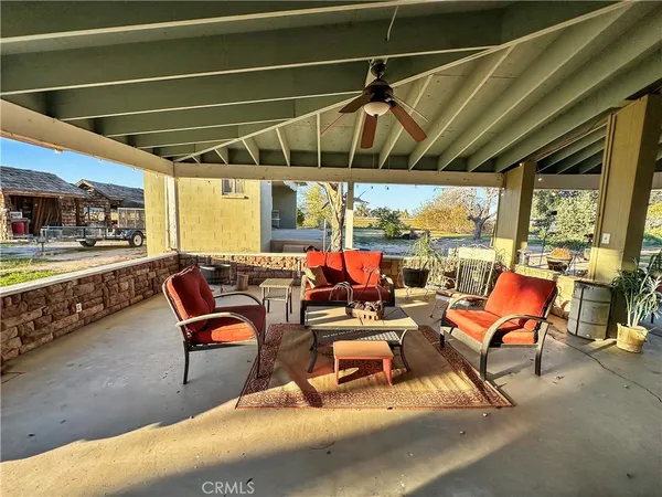 a view of a chairs and table in the outdoor room