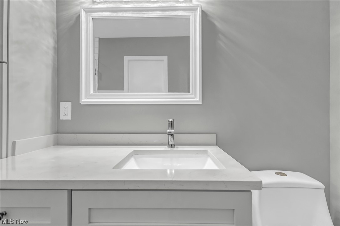 18230 Egbert Road Walton Hills, OH 44146 - Photo 24 of 34 Master Bathroom featuring toilet and oversized vanity with a quartz top