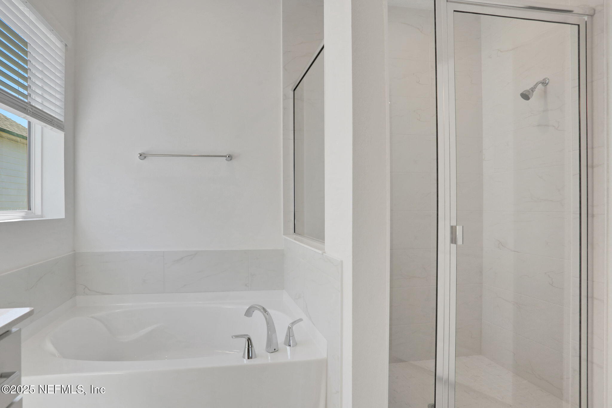 3257 Pipers Way Green Cove Springs, FL 32043 - Photo 12 of 42 a bathroom with bathtub and shower