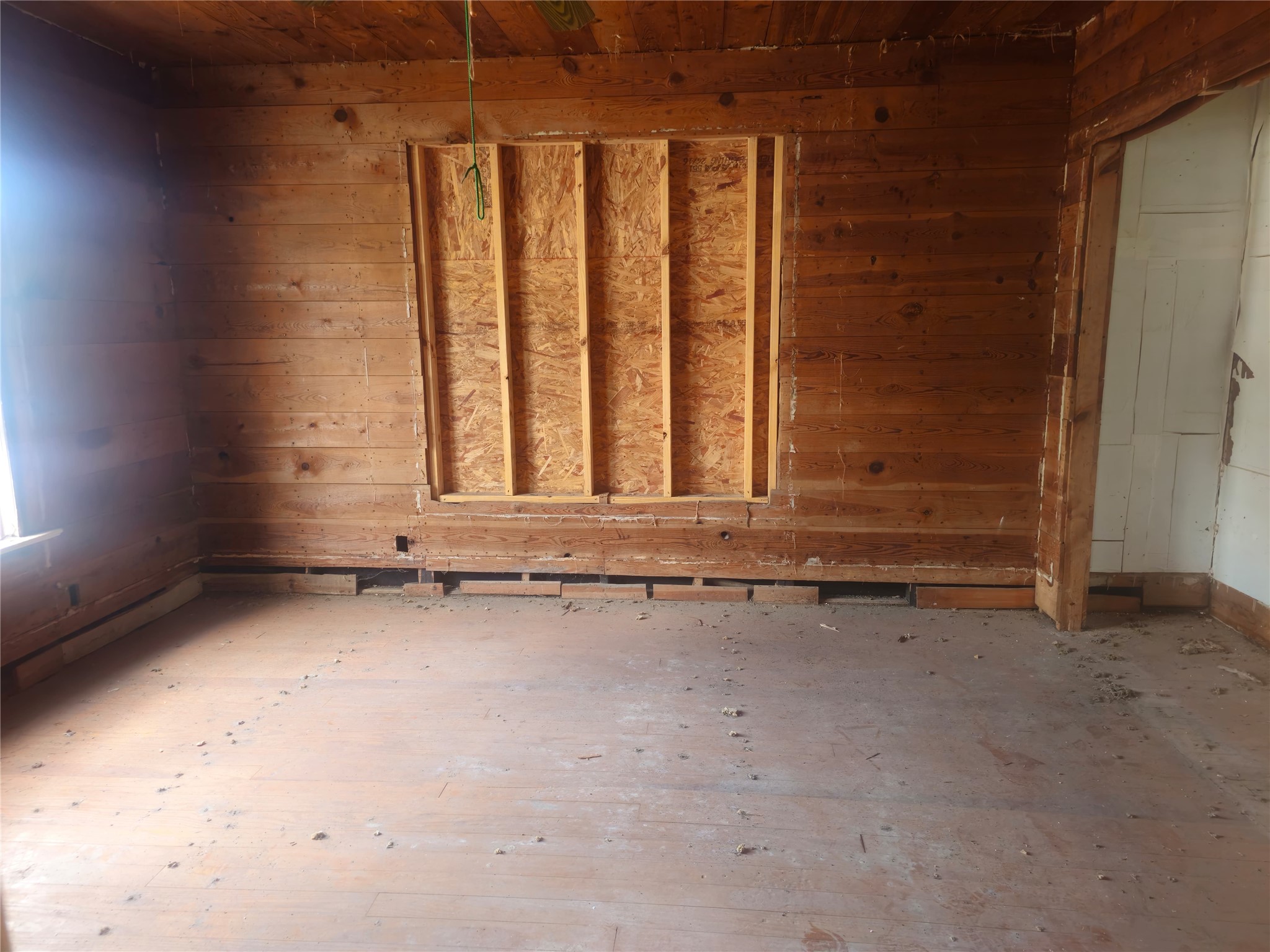 507 Merchant Street El Campo, TX 77437 - Photo 20 of 33 a view of a room with wooden floor and window