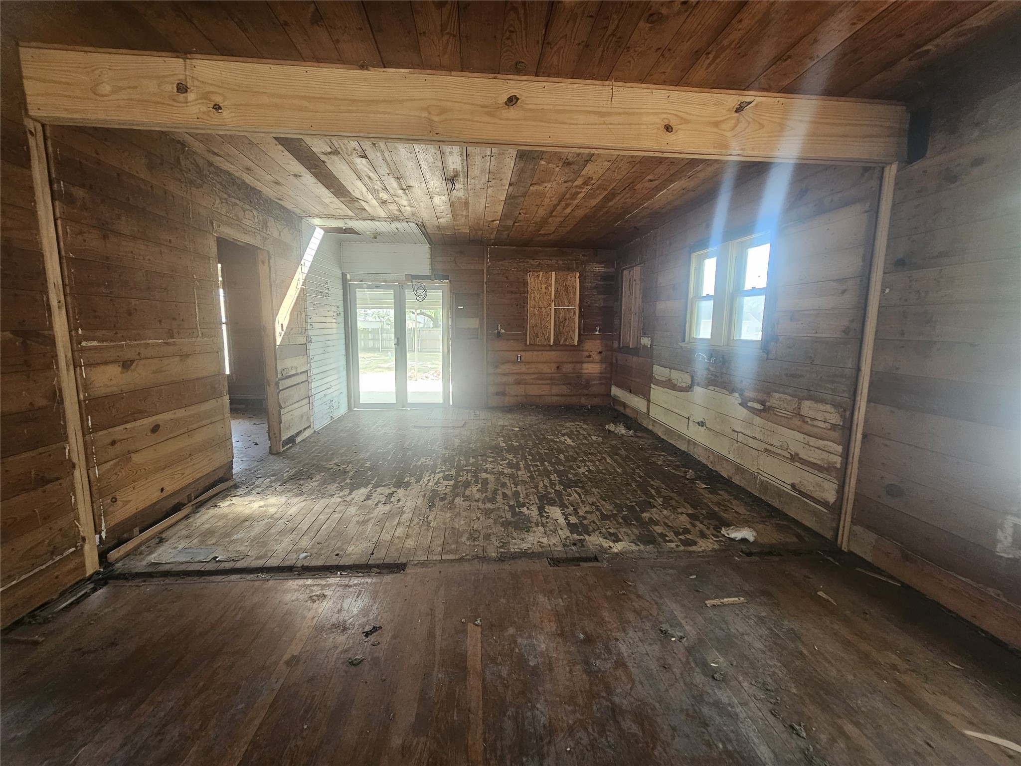 507 Merchant Street El Campo, TX 77437 - Photo 26 of 33 a view of a hallway with wooden floors
