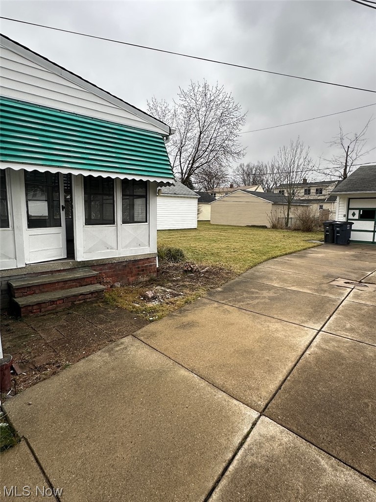 4994 North Barton Road Cleveland, OH 44124 - Photo 24 of 28 View of yard featuring a garage