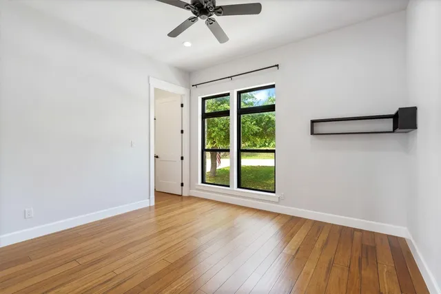 a kitchen with a refrigerator and a window