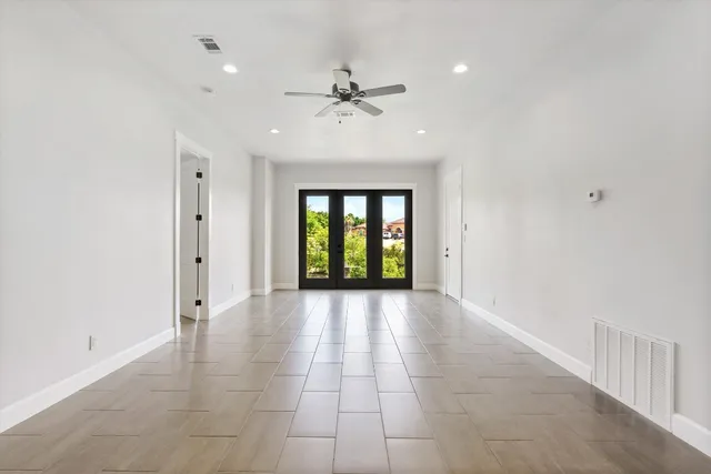 a view of a street with a building and a big yard