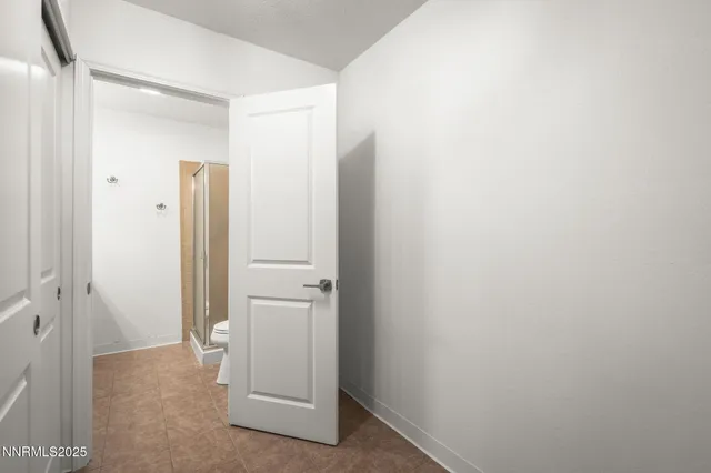 a view of a bathroom with a glass door