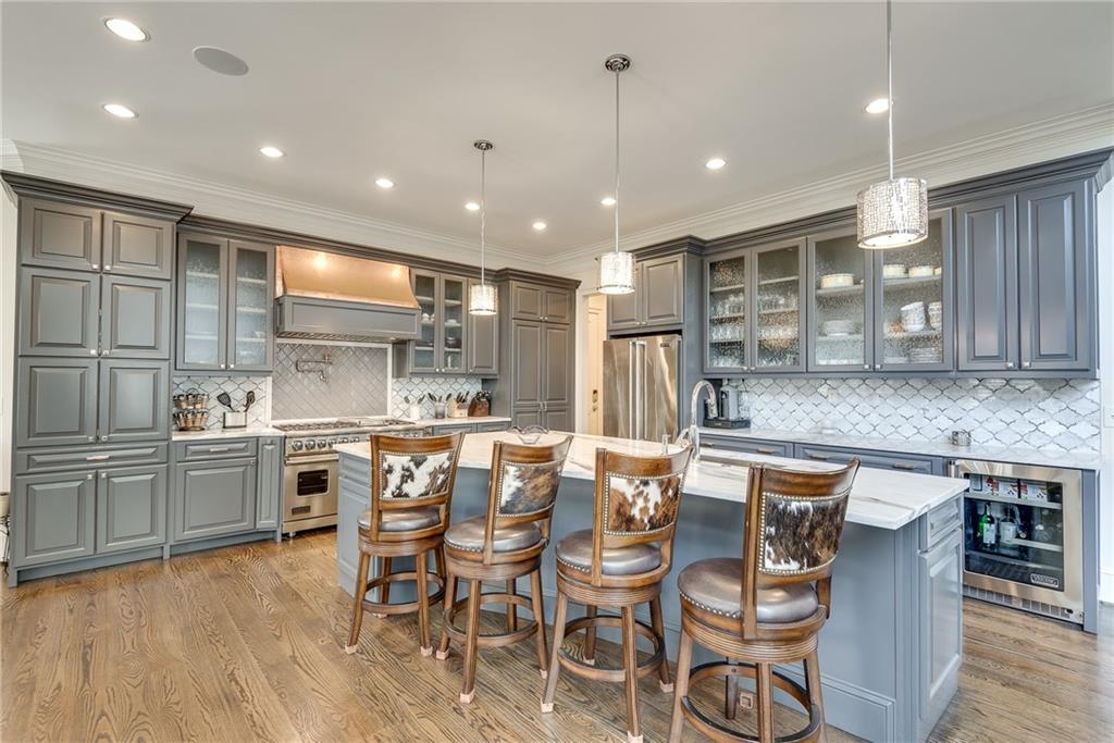 187 Fontaine Road Southwest Mableton, GA 30126 - Photo 25 of 84 a kitchen with stainless steel appliances granite countertop a kitchen island hardwood floor and a sink