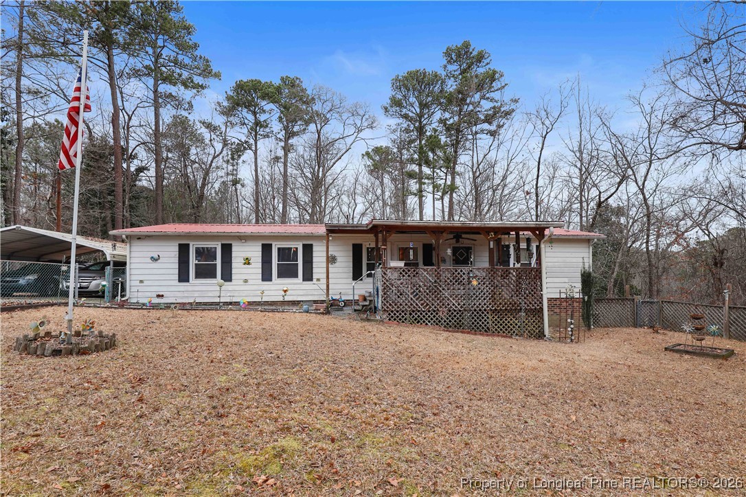 156 Connell Road Carthage, NC 28327 - Photo 1 of 43 a front view of a house with a yard and garage