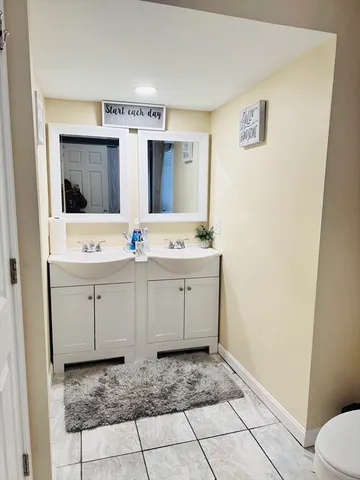a bathroom with a toilet and a shower curtain