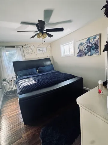 a living room with couches and flat screen tv