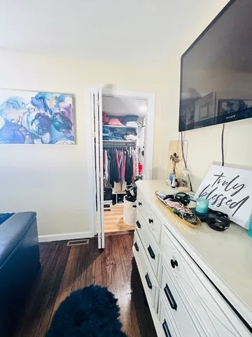 a living room with furniture rug and wooden floor