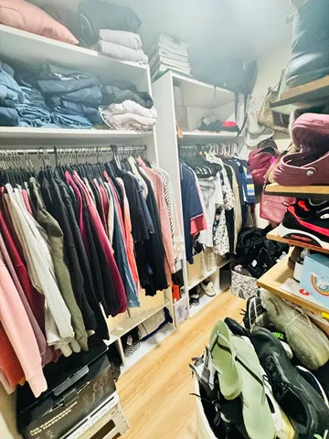 a bedroom with a bed and ceiling fan