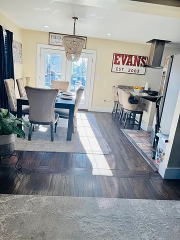 a view of a dining room with furniture and window