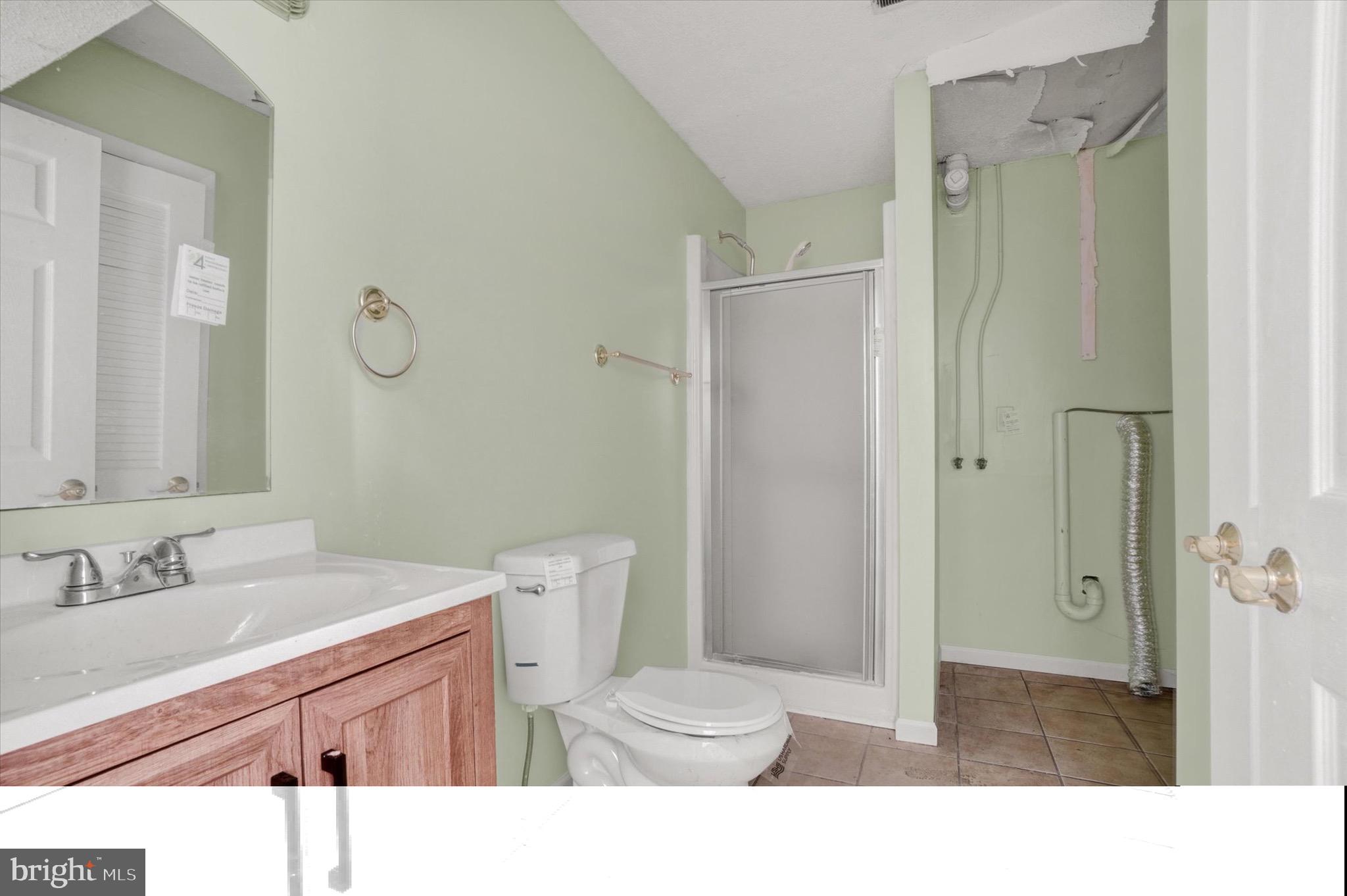 2700 Thornbridge Road East York, PA 17408 - Photo 12 of 18 a bathroom with a sink toilet a mirror and shower