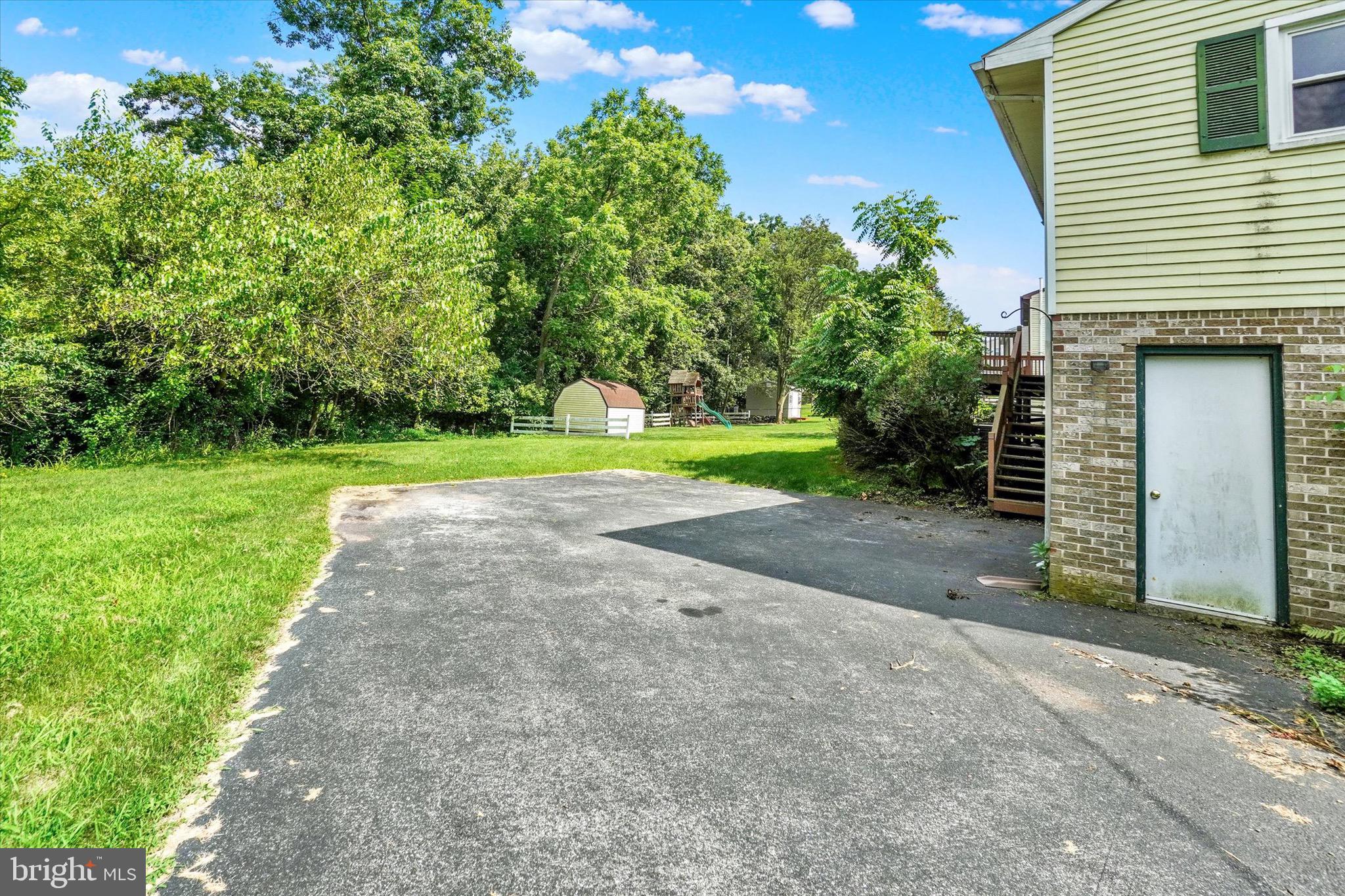 2700 Thornbridge Road East York, PA 17408 - Photo 17 of 18 a view of a backyard with large trees