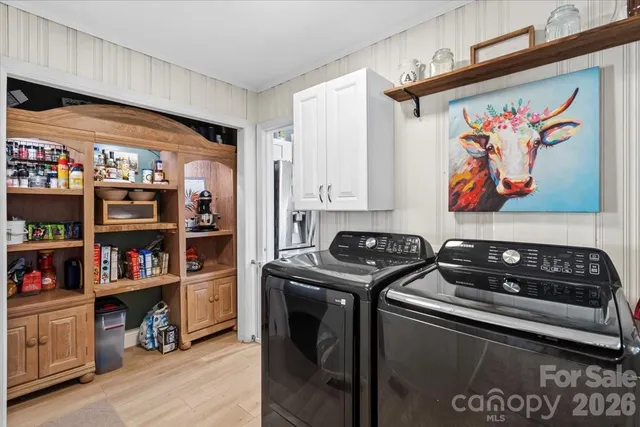 a bathroom with a sink a toilet a mirror a vanity and shower
