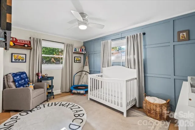 a view of a house with a yard and trees