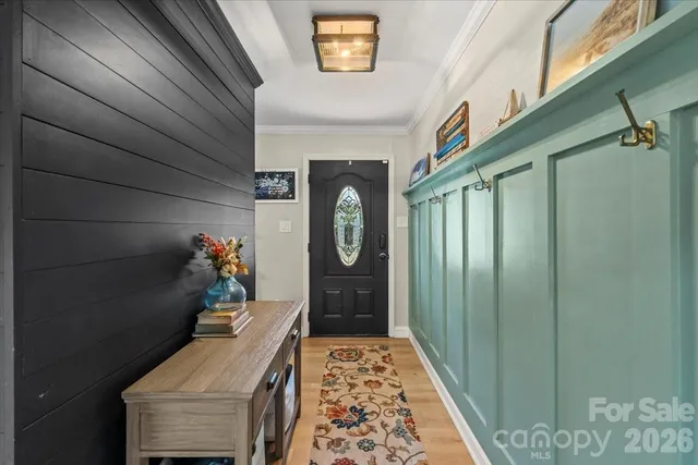 a living room with furniture a window and a fireplace