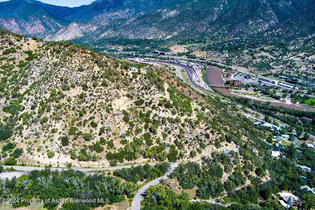 an outdoor space with lots of trees