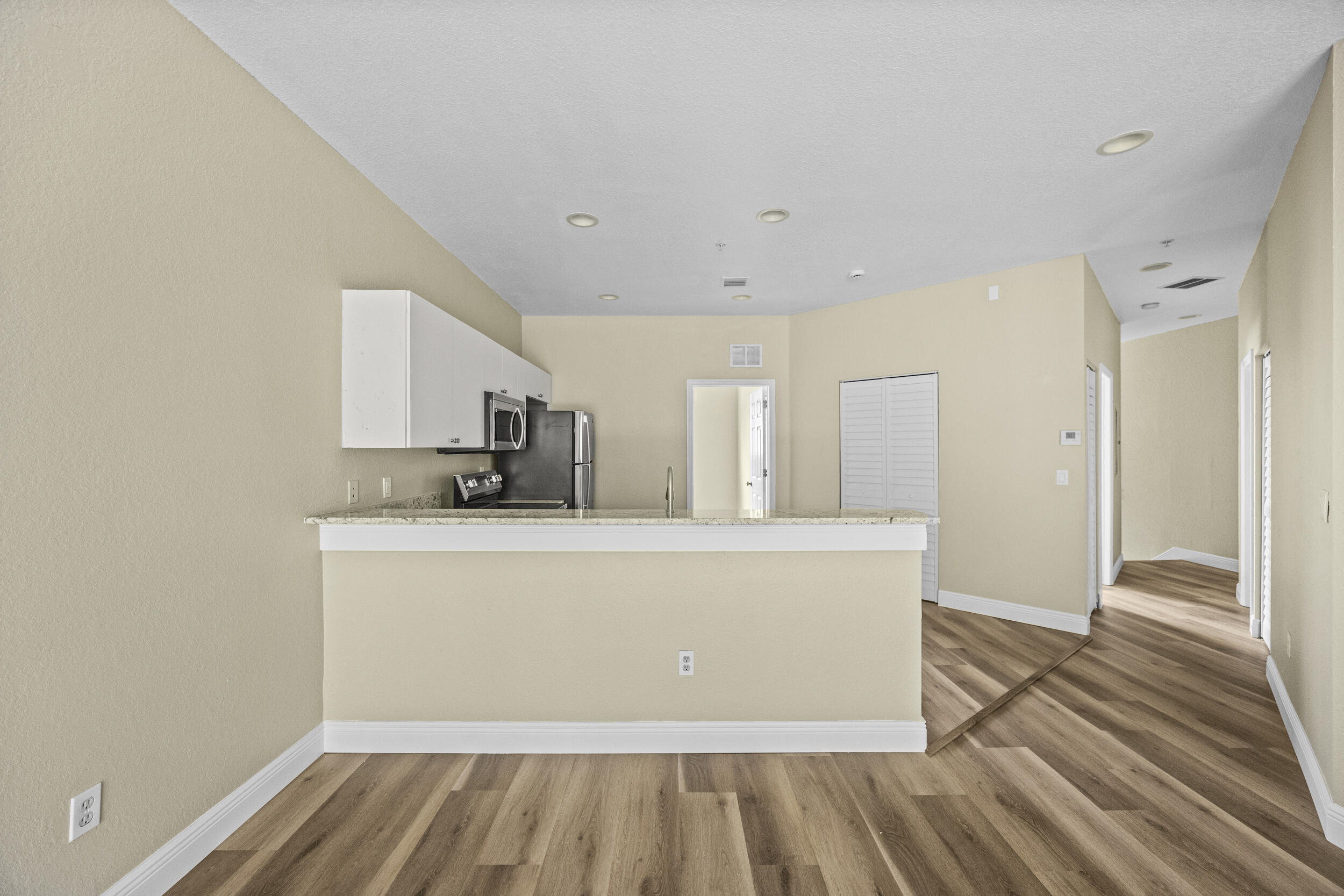 1982 Freeport Drive Riviera Beach, FL 33404 - Photo 14 of 29 a view of kitchen with wooden floor