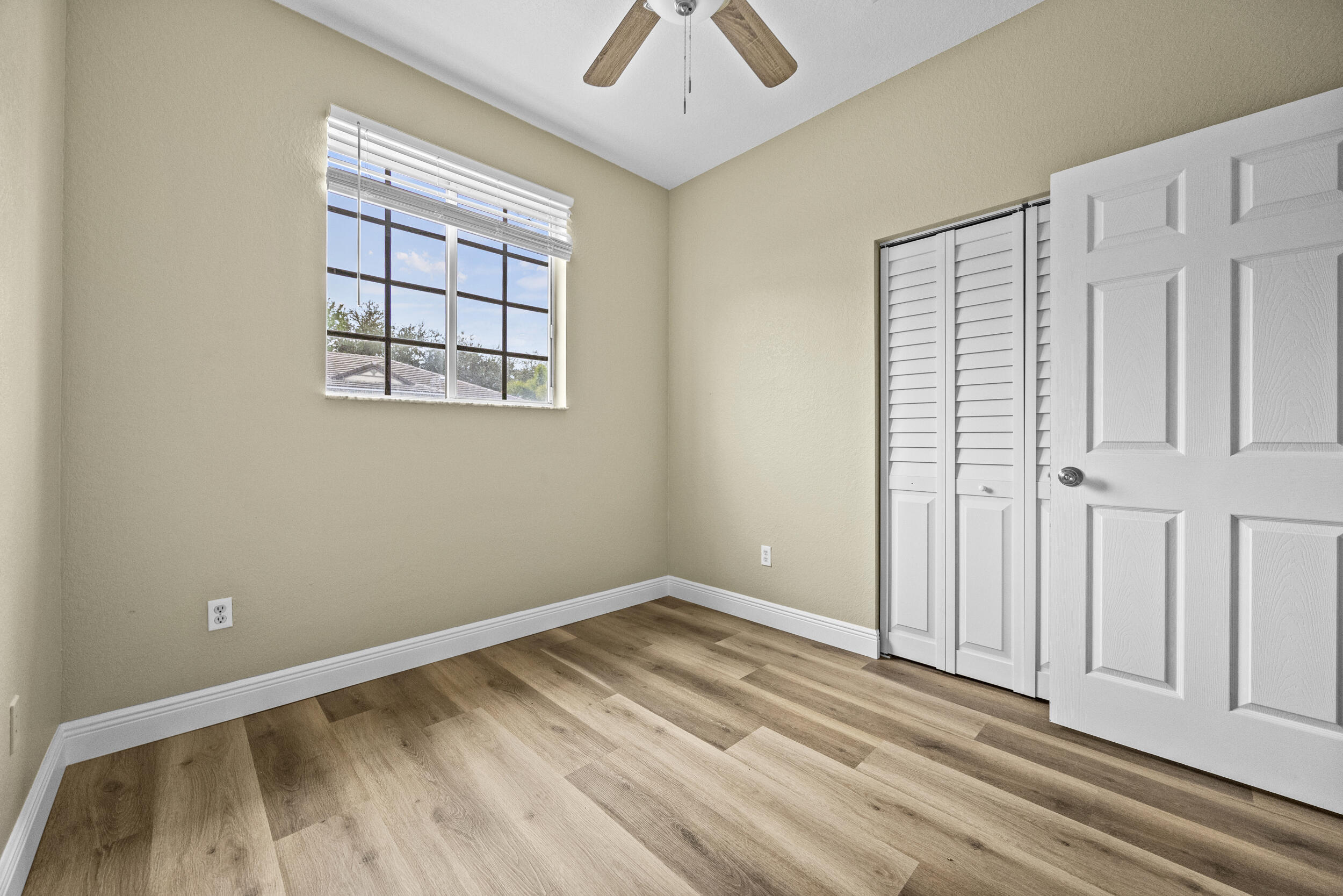 1982 Freeport Drive Riviera Beach, FL 33404 - Photo 25 of 29 an empty room with windows