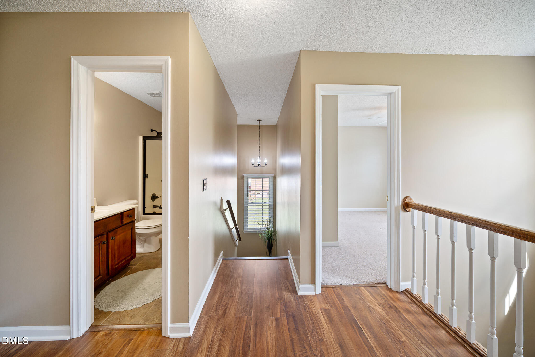 168 Tanning Ridge Drive Dunn, NC 28334 - Photo 17 of 33 a view of a hallway with wooden floor