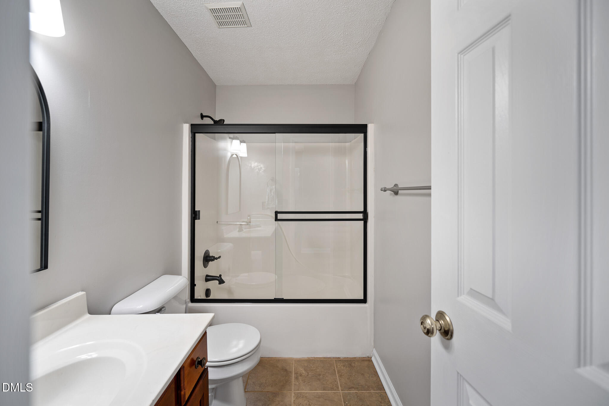 168 Tanning Ridge Drive Dunn, NC 28334 - Photo 19 of 33 a white toilet sitting next to a bathroom sink