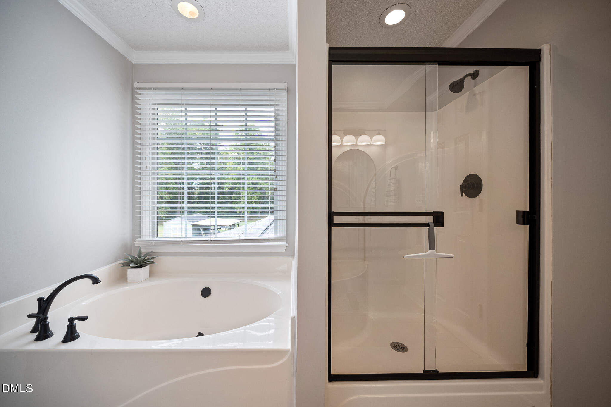 168 Tanning Ridge Drive Dunn, NC 28334 - Photo 22 of 33 a bathroom with a bathtub and a shower