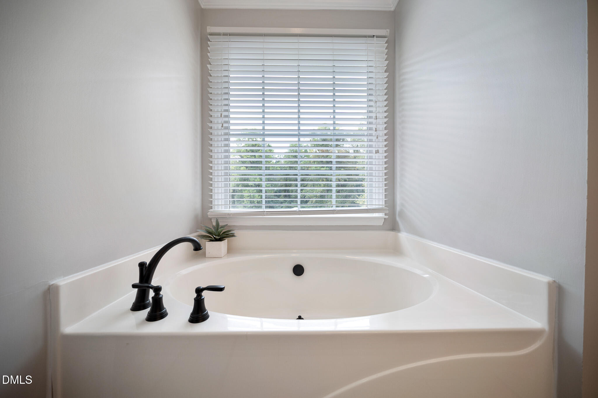 168 Tanning Ridge Drive Dunn, NC 28334 - Photo 23 of 33 a white bath tub sitting in a bathroom