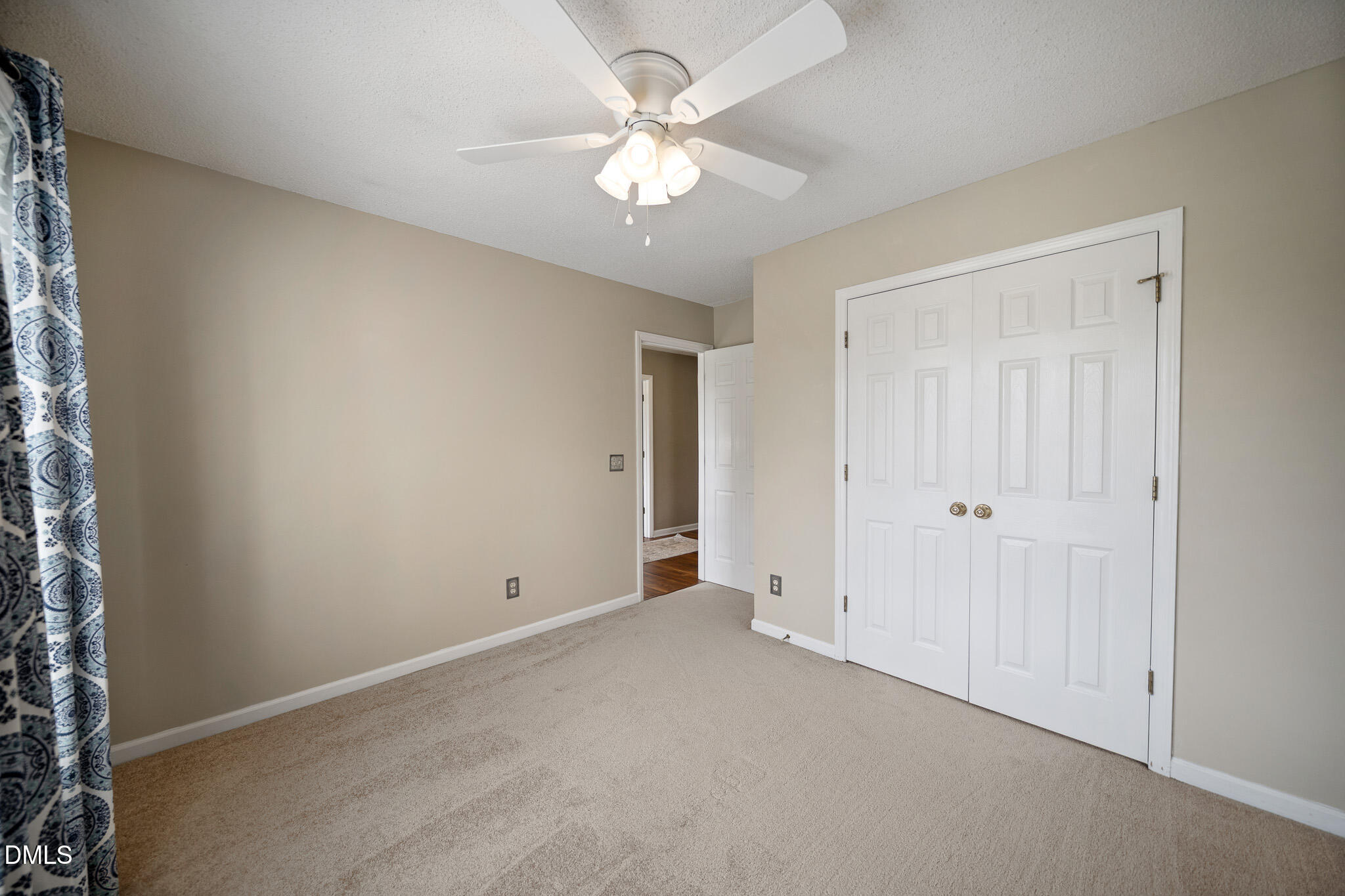 168 Tanning Ridge Drive Dunn, NC 28334 - Photo 26 of 33 a view of an empty room with a ceiling fan