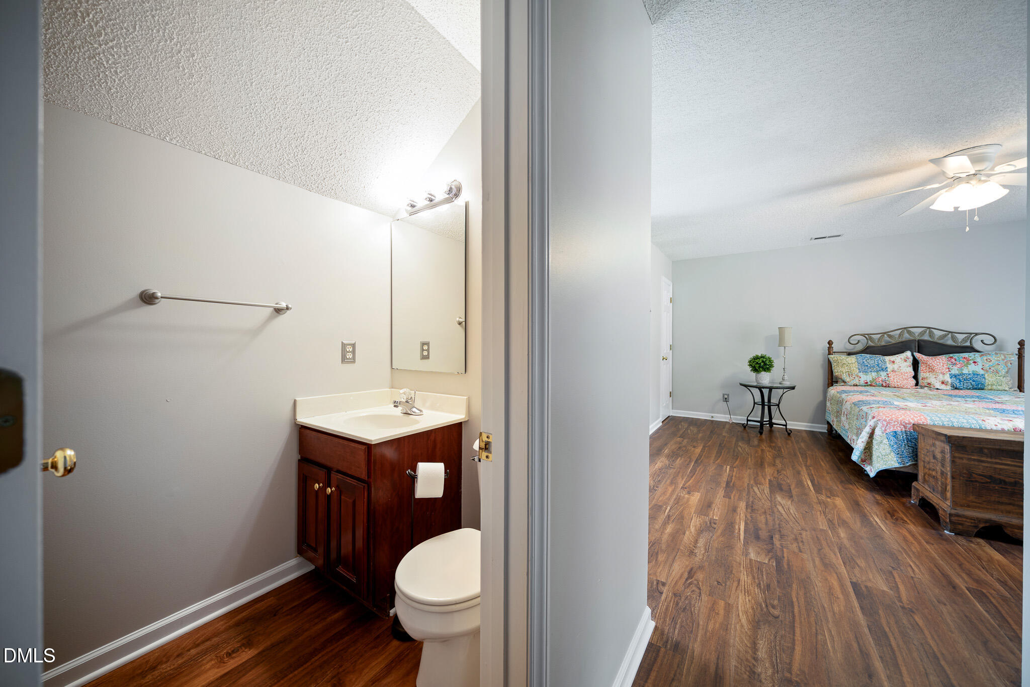 168 Tanning Ridge Drive Dunn, NC 28334 - Photo 28 of 33 a bathroom with a sink mirror vanity and toilet