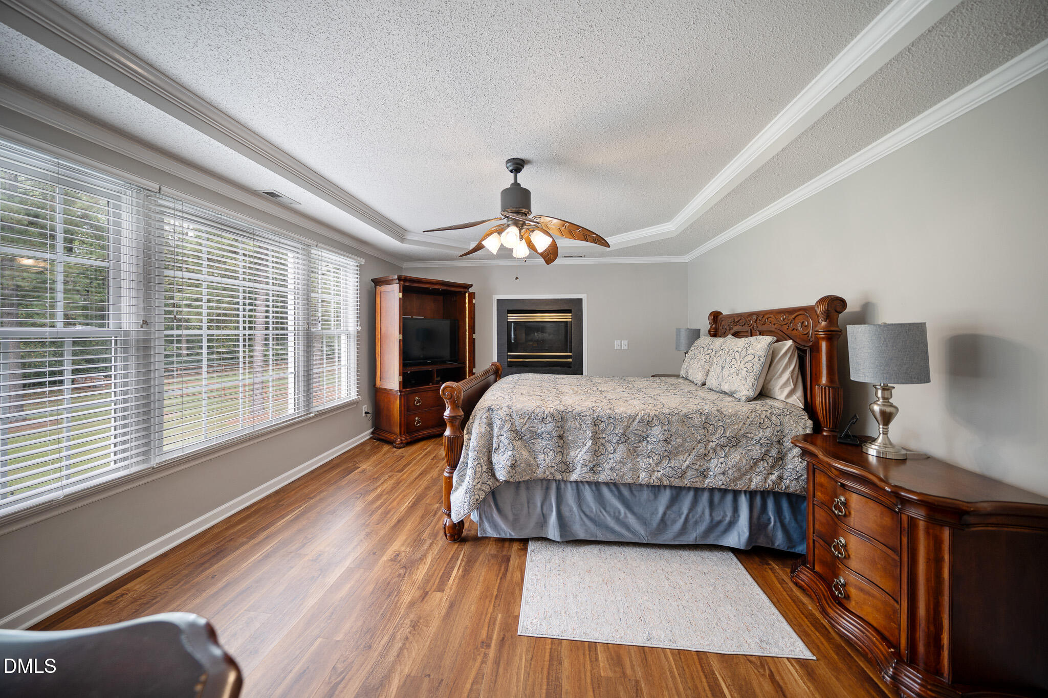 168 Tanning Ridge Drive Dunn, NC 28334 - Photo 6 of 33 a spacious bedroom with a bed and wooden floor